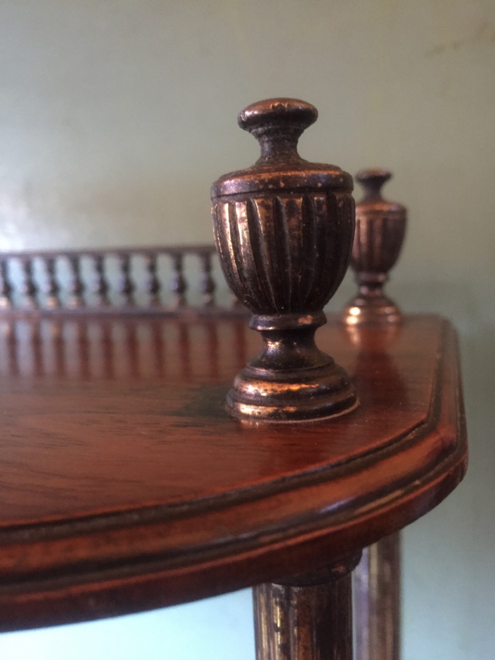 Set of late C19th walnut and brass-mounted shelves in the manner of James Shoolbred & Co., London. View IV