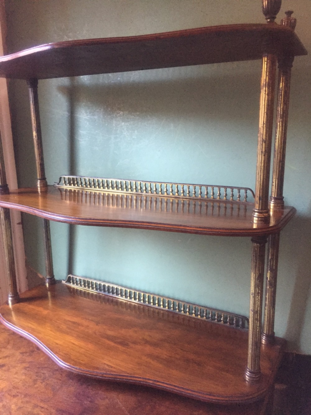 Set of late C19th walnut and brass-mounted shelves in the manner of James Shoolbred & Co., London. View VI