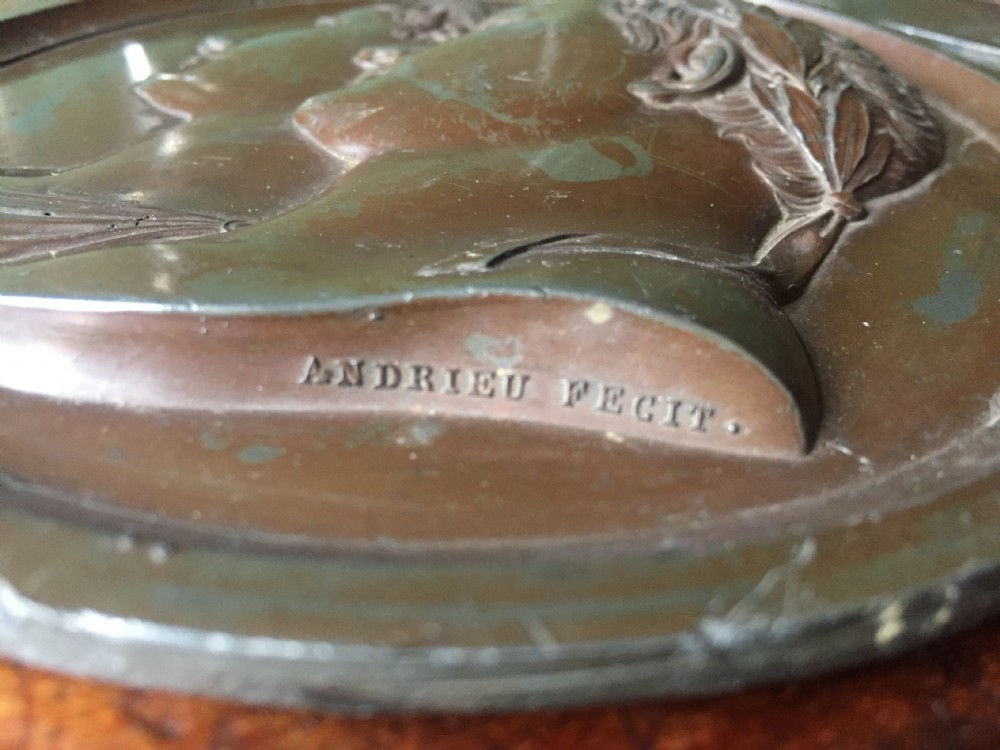 A pair of circular turned mahogany frames enclosing dark bronzed relief profile portraits of Napoleon and Marie-Louise under glass. View VIII