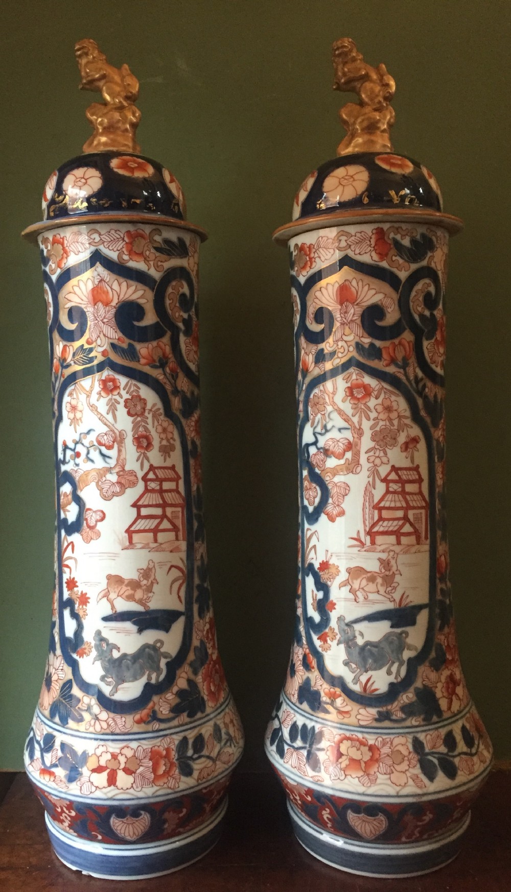 Fine pair of mid C19th Japanese Imari pattern porcelain lidded vases of unusual shape and form .