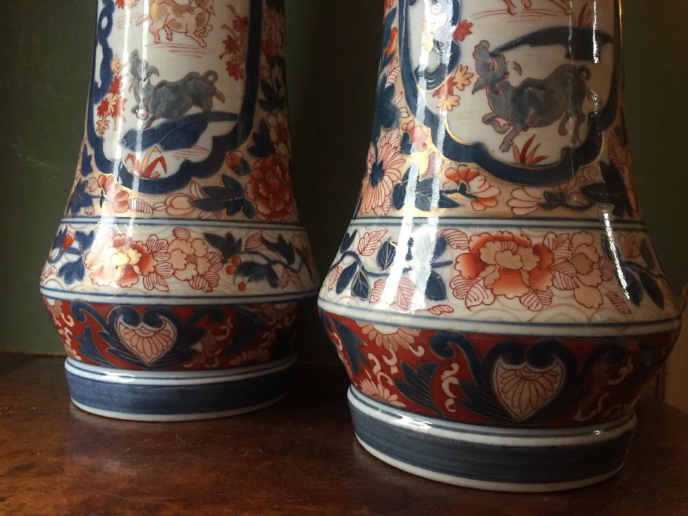 Fine pair of mid C19th Japanese Imari pattern porcelain lidded vases of unusual shape and form . View XVIII