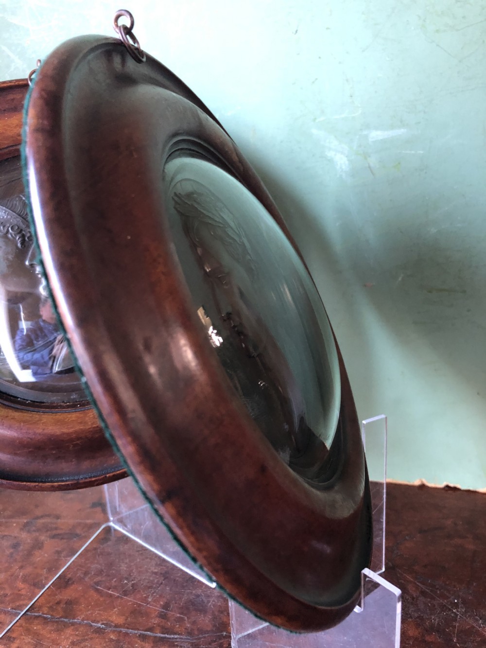 A pair of circular turned mahogany frames enclosing dark bronzed relief profile portraits of Napoleon and Marie-Louise under glass. View XVIII