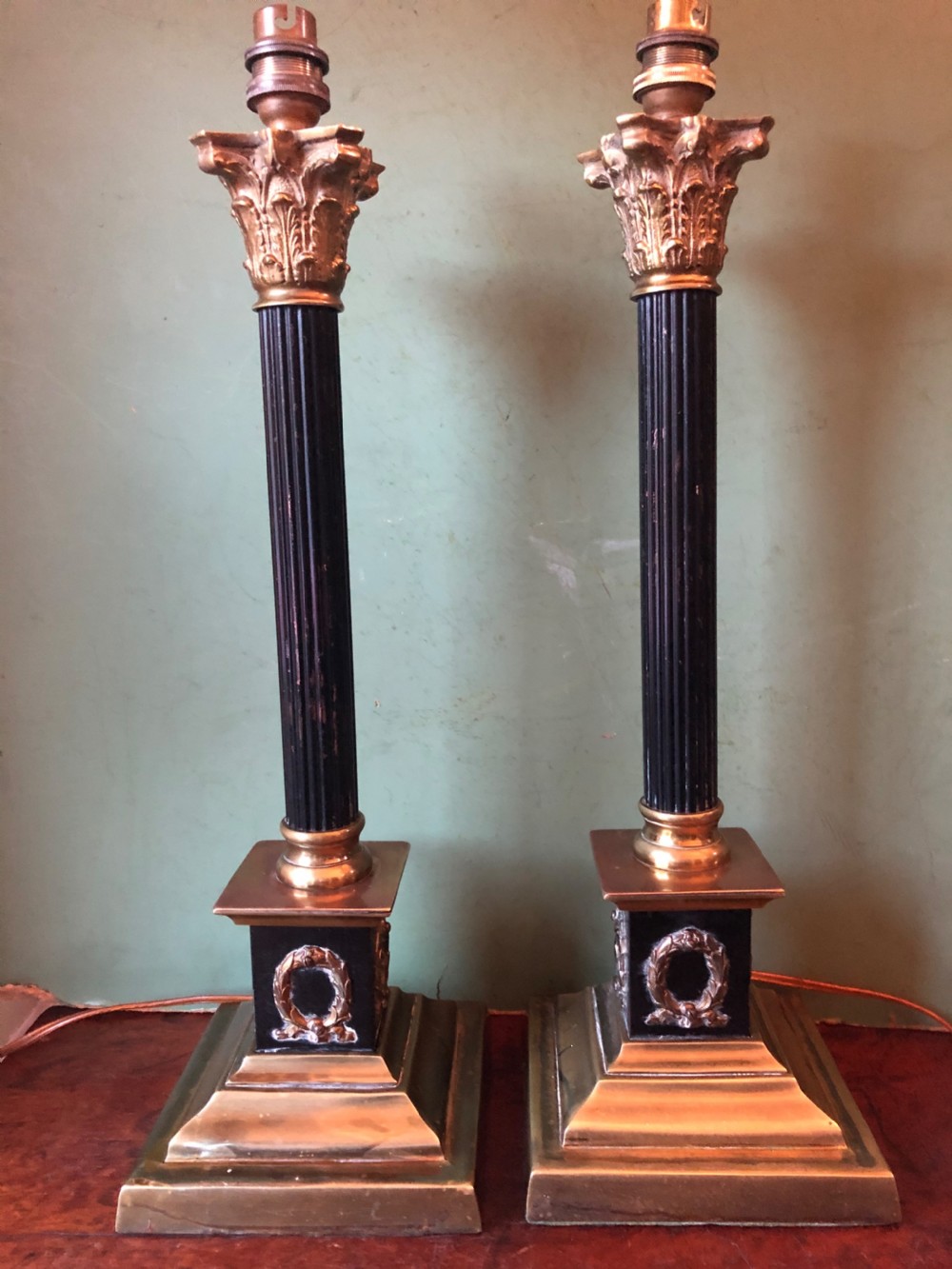 Pair of early C20th patinated and polished brass table lamps of classical column form. View II