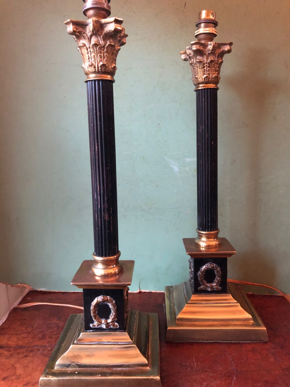 Pair of early C20th patinated and polished brass table lamps of classical column form. View III