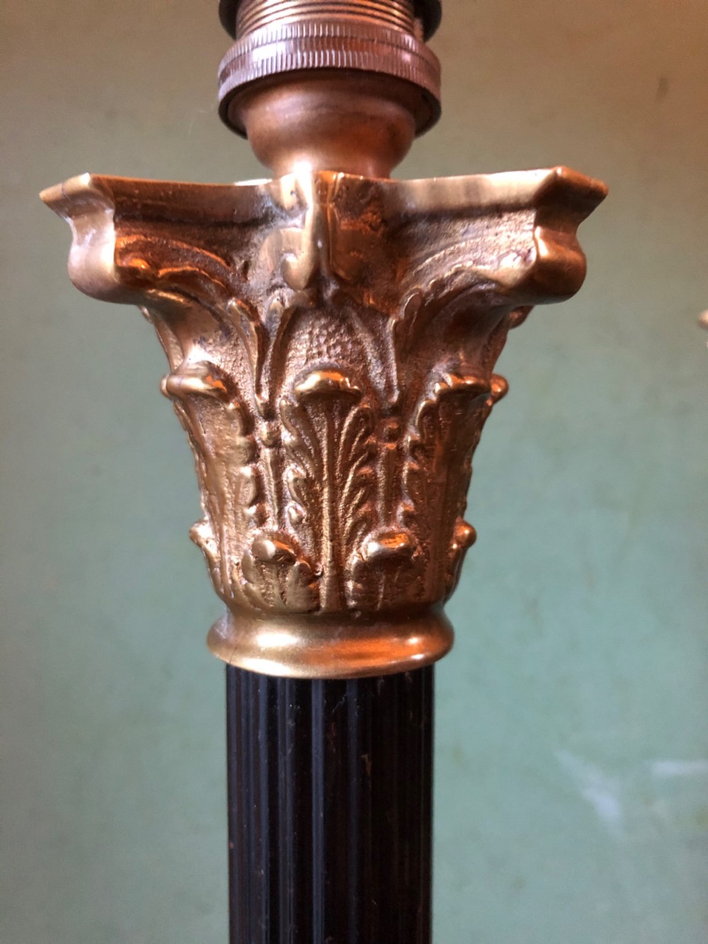 Pair of early C20th patinated and polished brass table lamps of classical column form. View IV