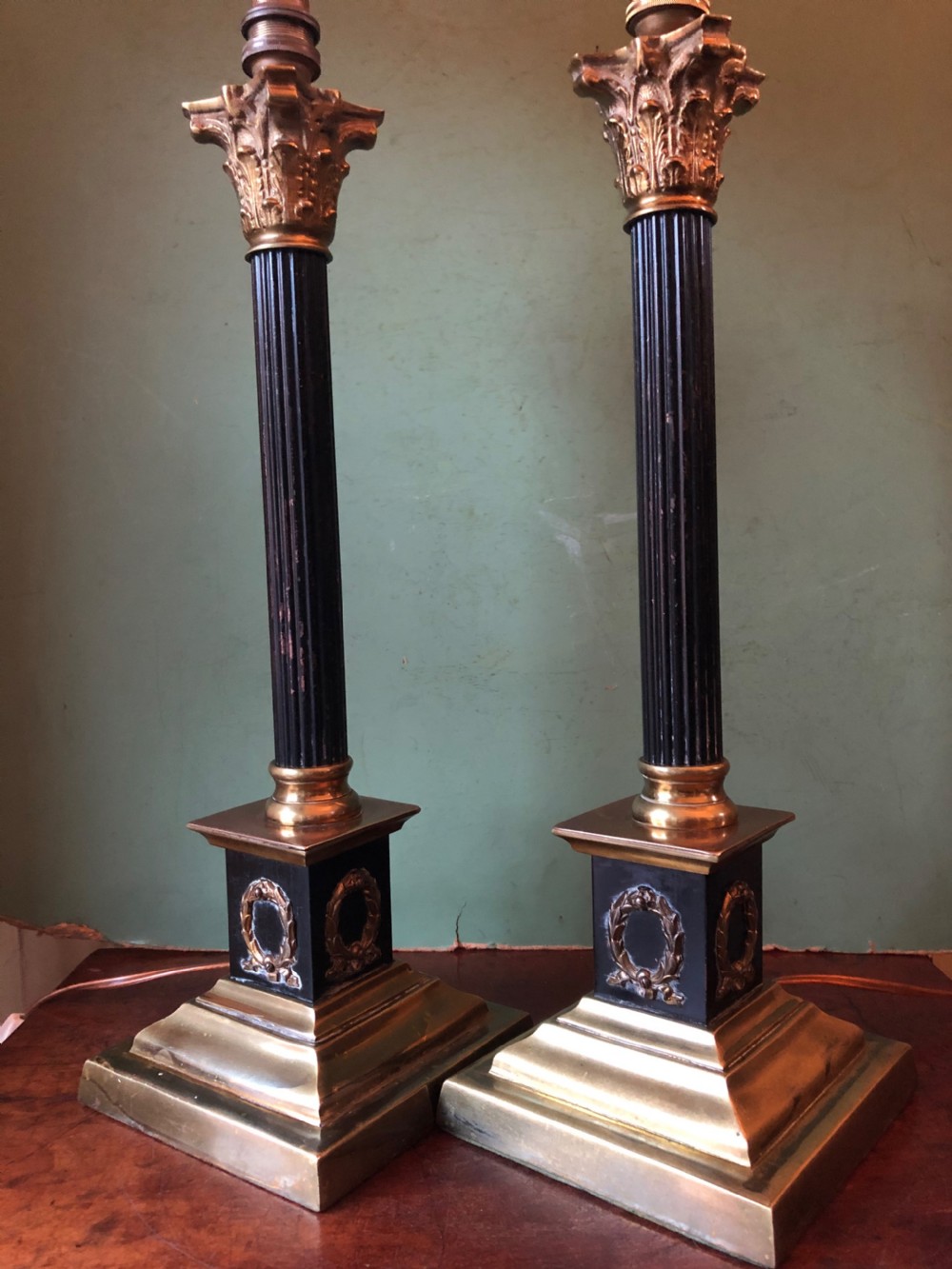 Pair of early C20th patinated and polished brass table lamps of classical column form. View V