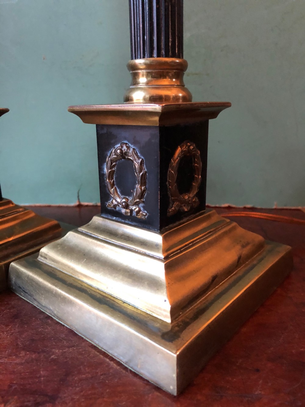 Pair of early C20th patinated and polished brass table lamps of classical column form. View VI