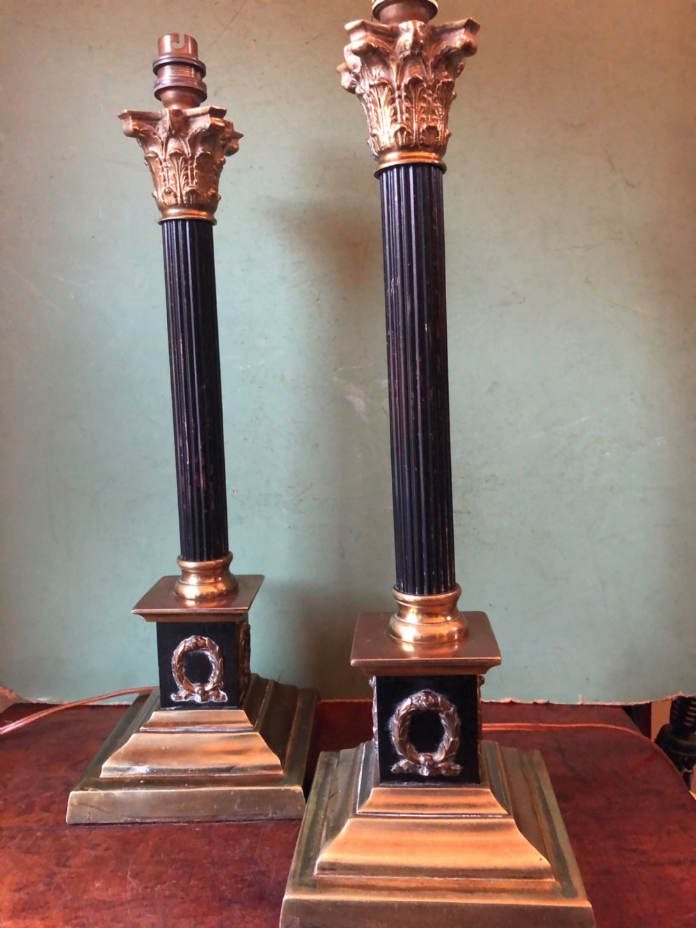 Pair of early C20th patinated and polished brass table lamps of classical column form. View VIII