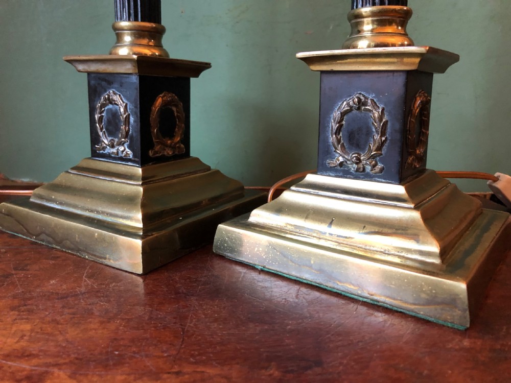Pair of early C20th patinated and polished brass table lamps of classical column form. View IX