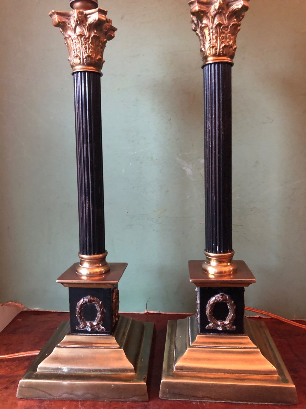 Pair of early C20th patinated and polished brass table lamps of classical column form. View X