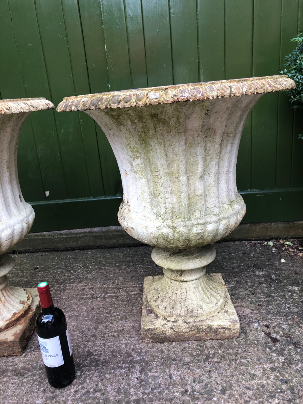 Large scale pair of early C19th Regency period cast-iron terrace or garden vases of campana form . View V