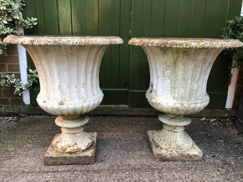 Large scale pair of early C19th Regency period cast-iron terrace or garden vases of campana form .
