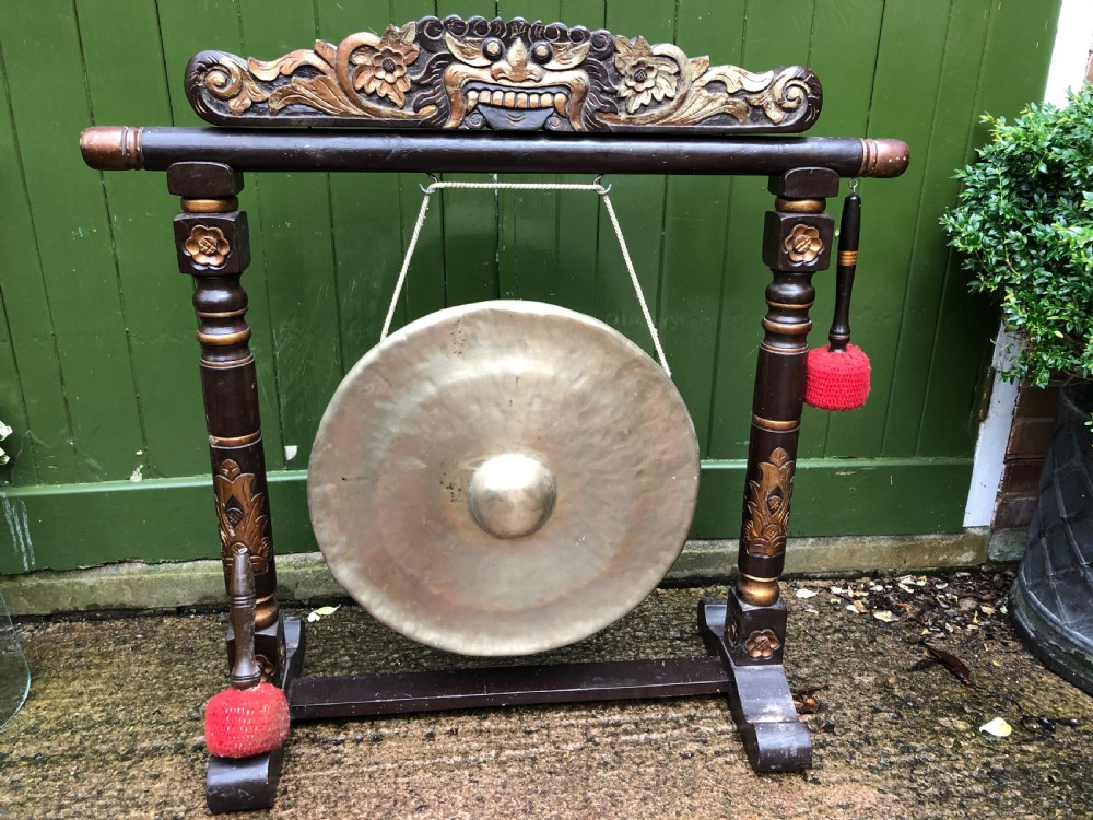 Early C20th Chinese temple-style bronze gong on lacquered stand .