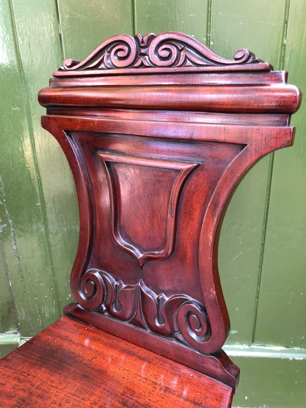 Pair of early C19th George IV period mahogany hall chairs of Grecian revival design. View IX