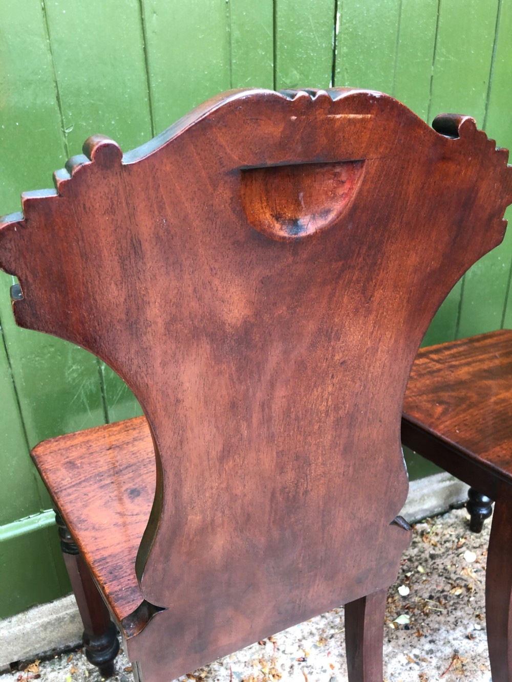 Pair of early C19th George IV period mahogany hall chairs of Grecian revival design. View XI
