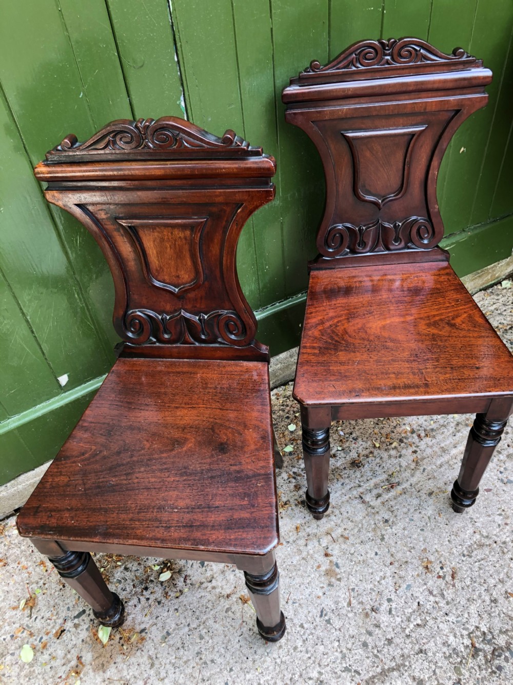 Pair of early C19th George IV period mahogany hall chairs of Grecian revival design. View XIII