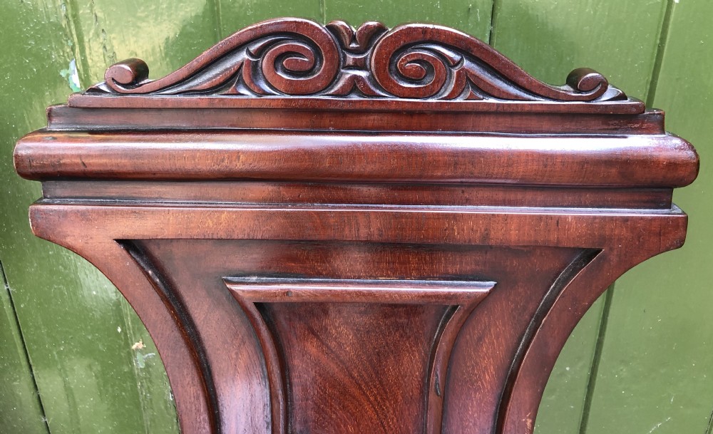 Pair of early C19th George IV period mahogany hall chairs of Grecian revival design. View VIII