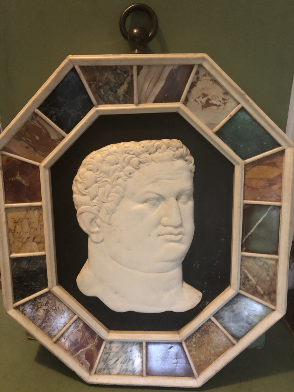 Large early C20th Italian ‘Grand Tour’ style carved marble profile in octagonal specimen marble surround frame .