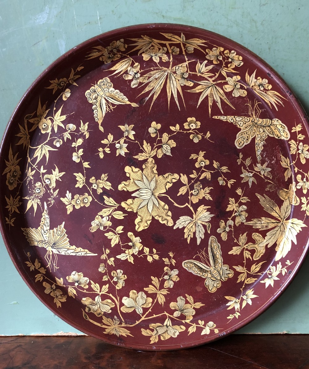 Early C19th Regency period maroon and gilt papier-mâché circular tray by Clay , London. View III