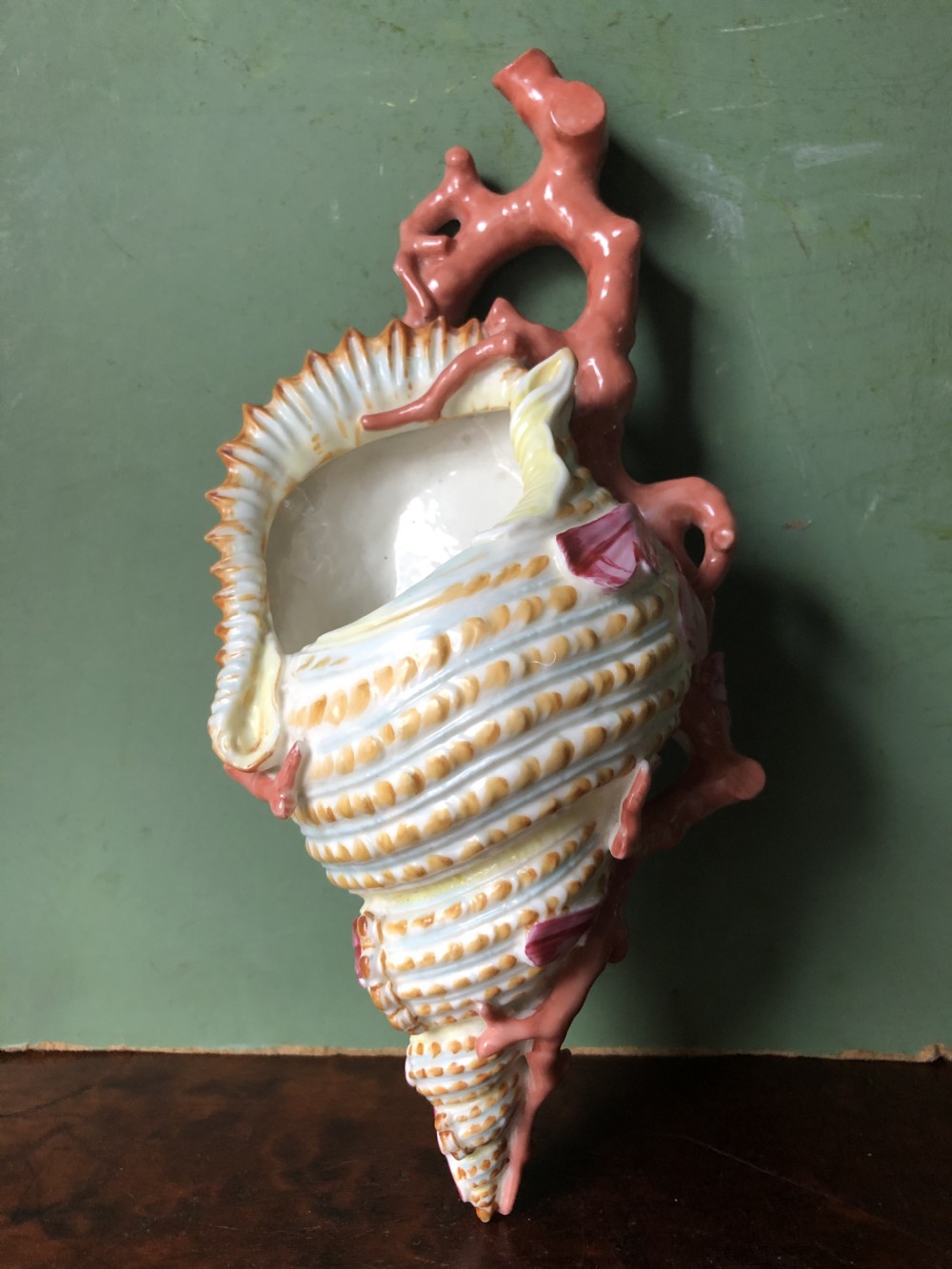 C19th Royal Worcester porcelain wall-pocket modelled as a sea-shell wrapped with coral branches. View XII