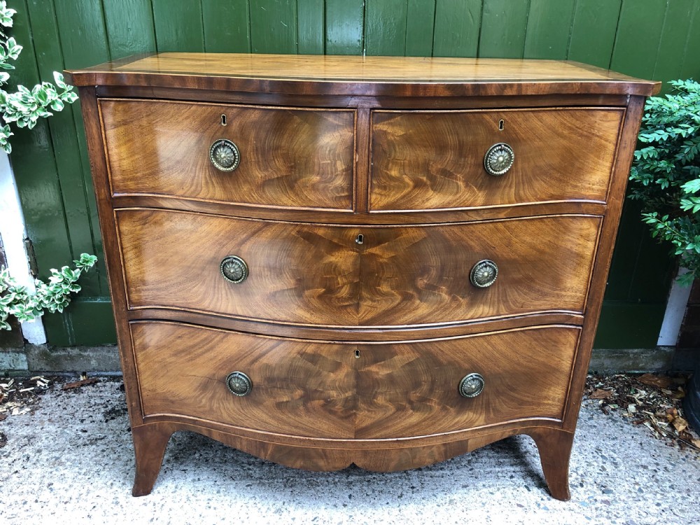 Early C19th Regency period mahogany serpentine-outline chest of drawers . View V
