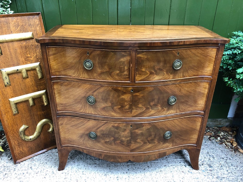 Early C19th Regency period mahogany serpentine-outline chest of drawers . View VII