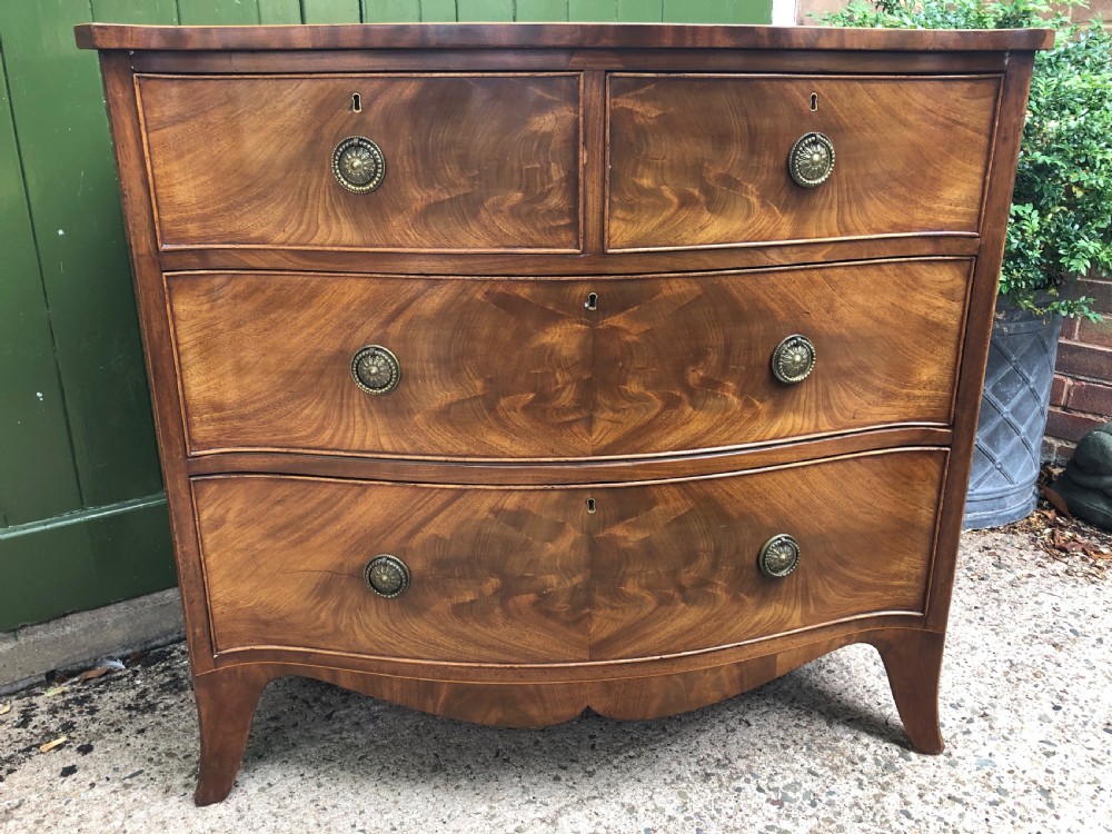 Early C19th Regency period mahogany serpentine-outline chest of drawers . View XIV