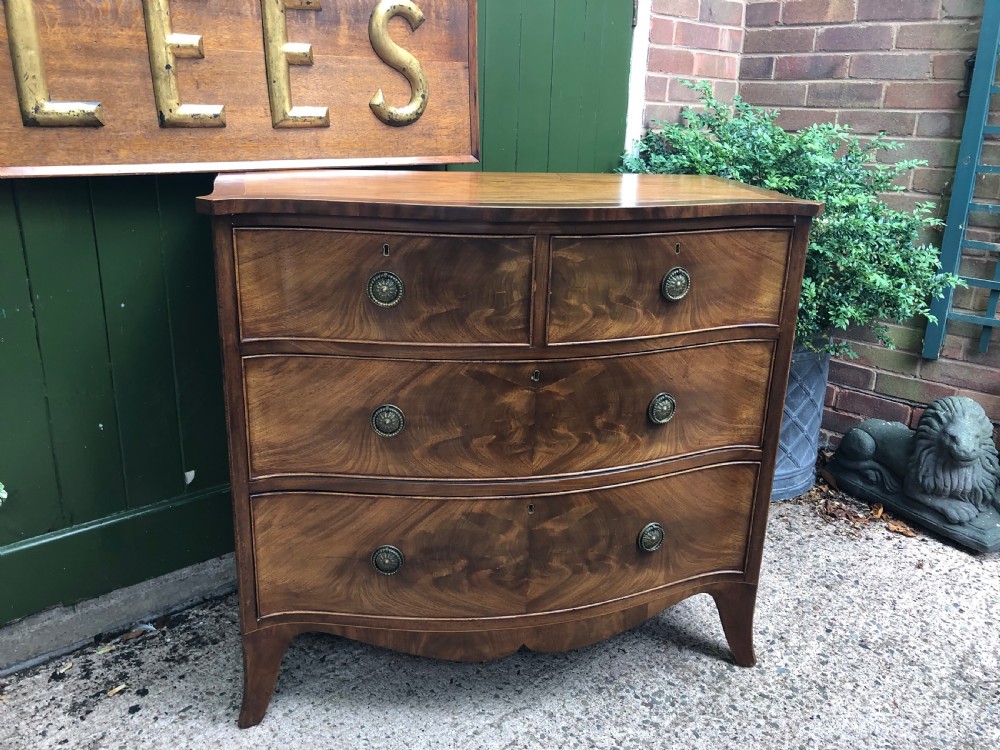 Early C19th Regency period mahogany serpentine-outline chest of drawers . View XV