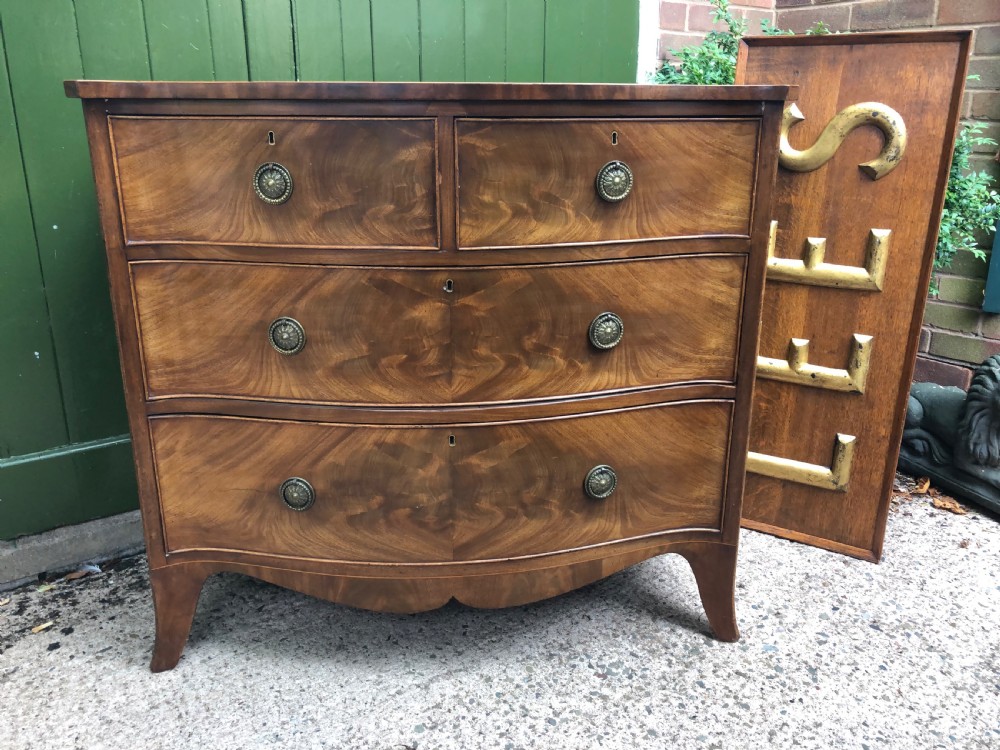 Early C19th Regency period mahogany serpentine-outline chest of drawers . View XVI