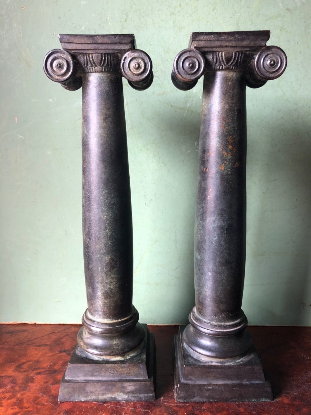 Pair of late C19th bronze classical column candlesticks.