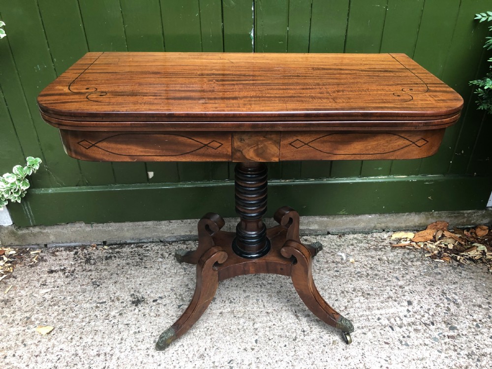 Early C19th Regency period mahogany and ebony string-inlaid fold-over card or games  table .