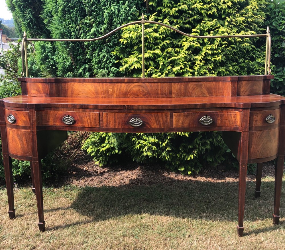 Late C18th George III period Scottish mahogany serpentine-front sideboard .