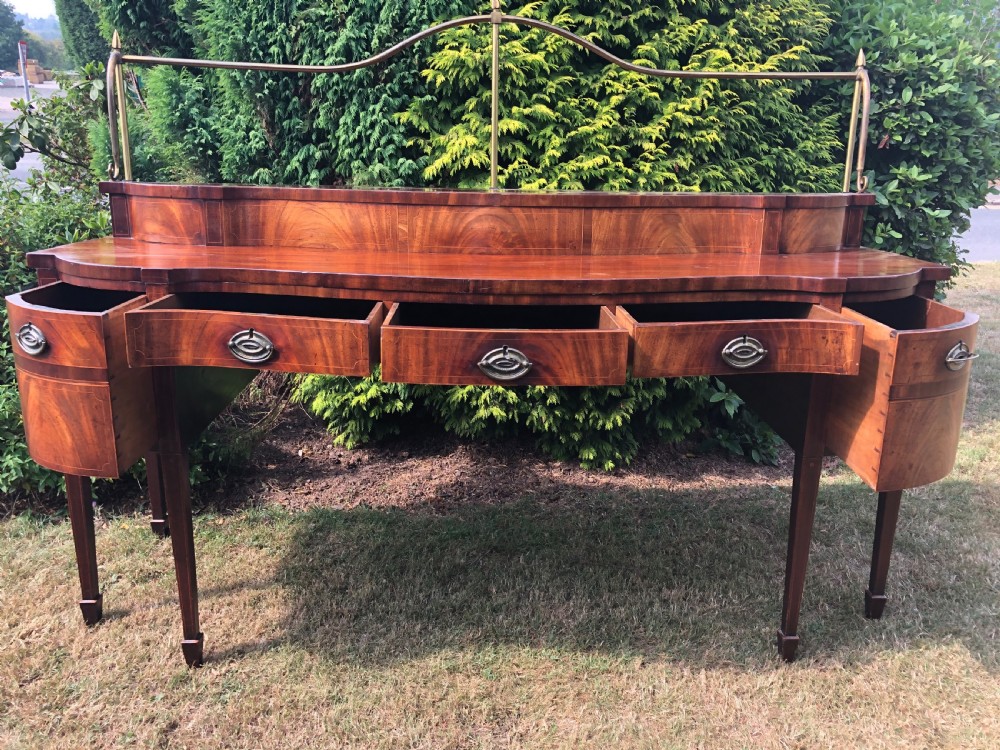 Late C18th George III period Scottish mahogany serpentine-front sideboard . View X