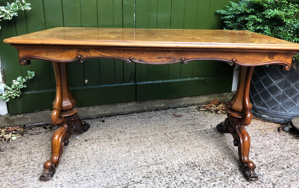 Mid C19th early Victorian period carved walnut centre or library table of free-standing form . View II