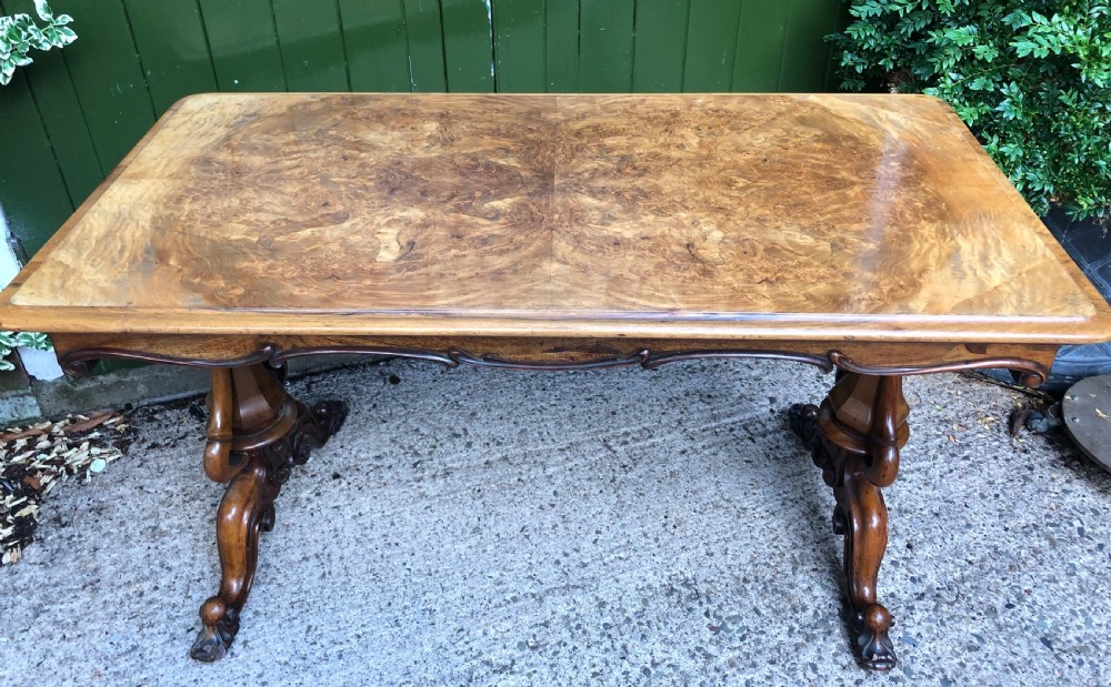 Mid C19th early Victorian period carved walnut centre or library table of free-standing form . View III