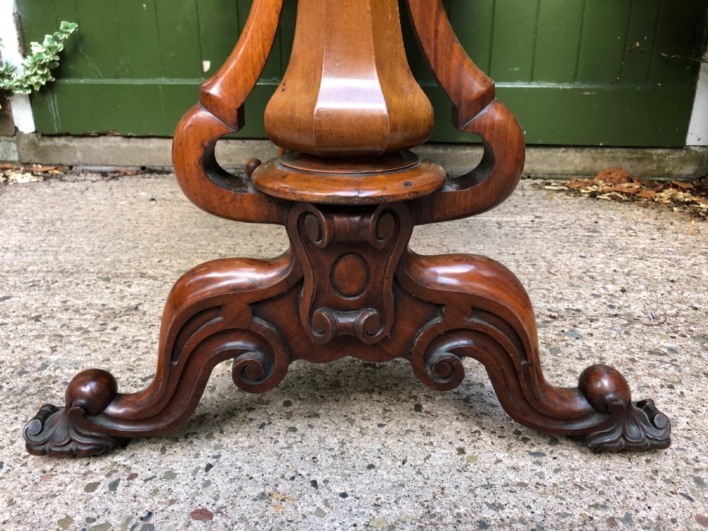 Mid C19th early Victorian period carved walnut centre or library table of free-standing form . View VI
