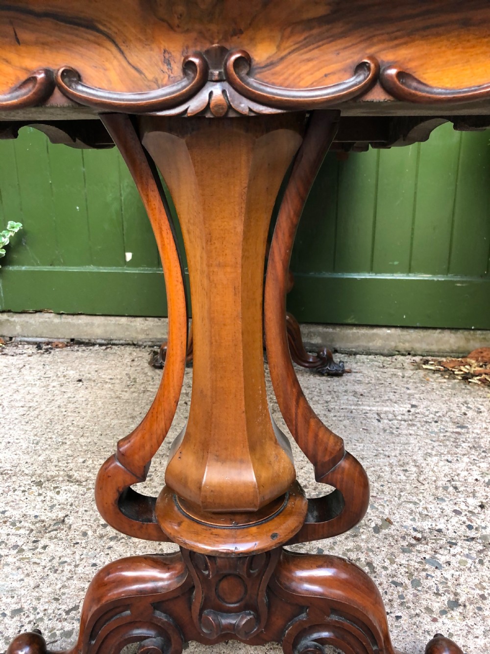 Mid C19th early Victorian period carved walnut centre or library table of free-standing form . View VII
