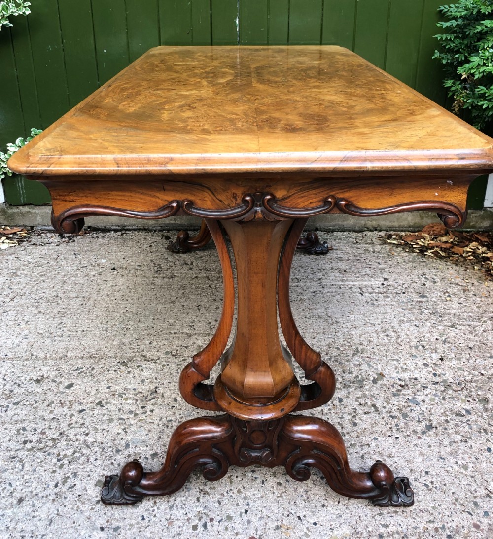 Mid C19th early Victorian period carved walnut centre or library table of free-standing form . View VIII