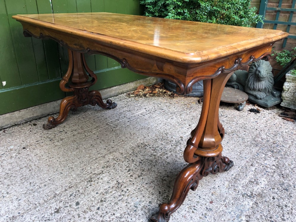 Mid C19th early Victorian period carved walnut centre or library table of free-standing form . View IX