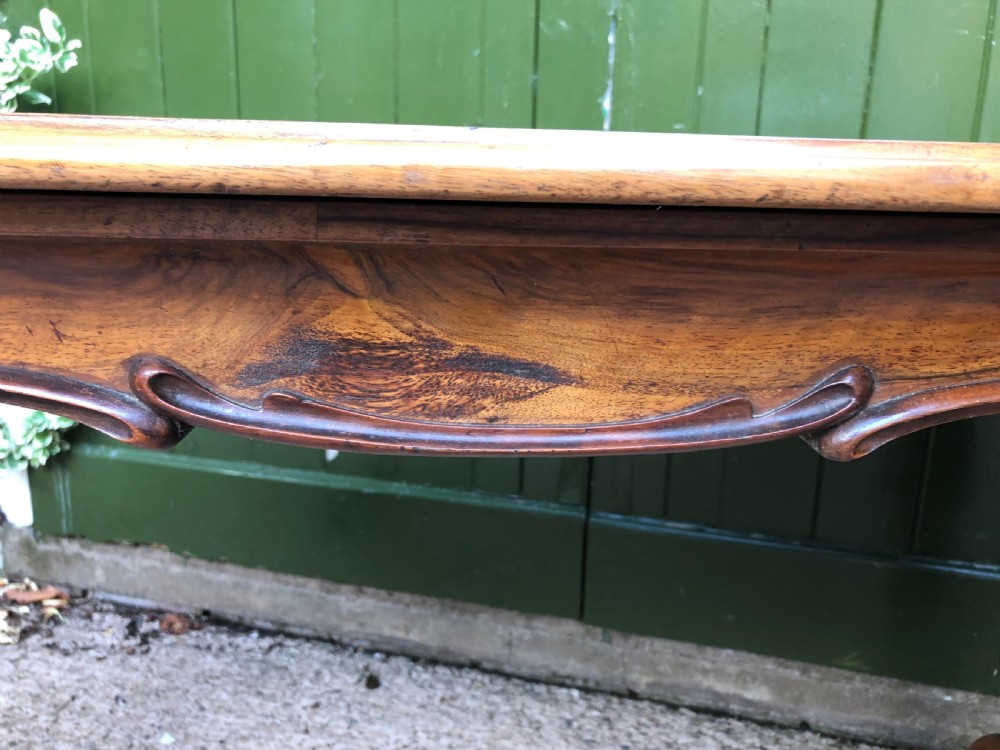 Mid C19th early Victorian period carved walnut centre or library table of free-standing form . View XII