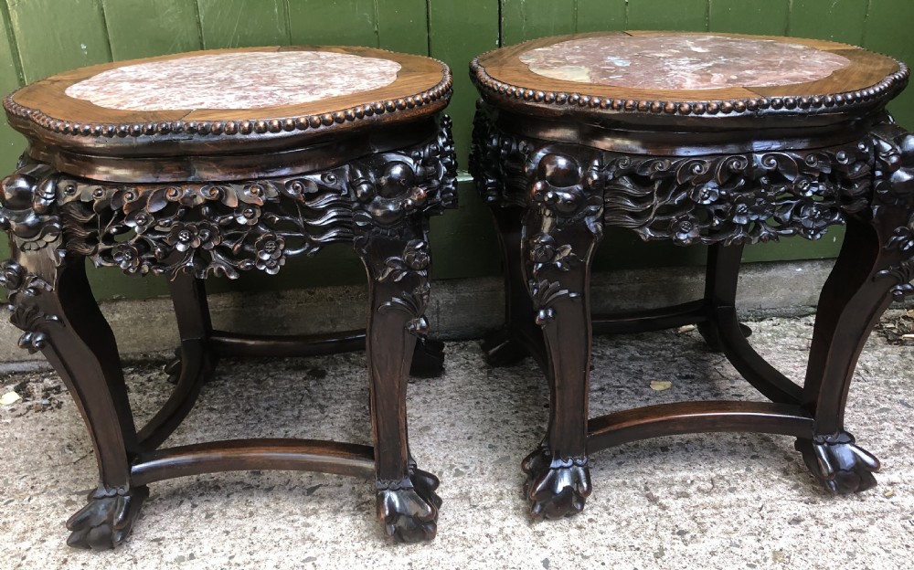 Pair of late C19th Chinese Qing Dynasty carved hardwood marble-topped tables or bowl-stands .