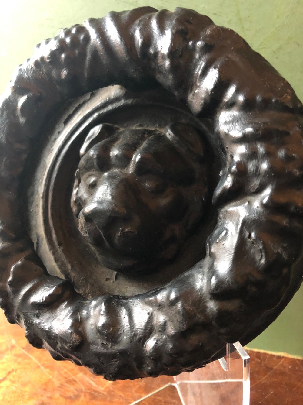 C19th Regency period cast-iron door knocker modelled as a laurel wreath ring with a leopard’s mask centre . View III