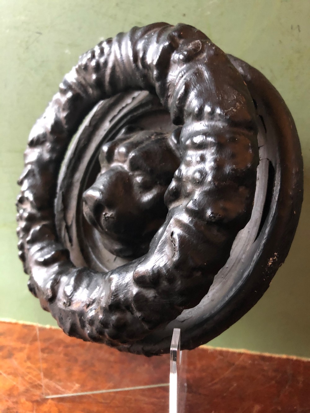 C19th Regency period cast-iron door knocker modelled as a laurel wreath ring with a leopard’s mask centre . View VII
