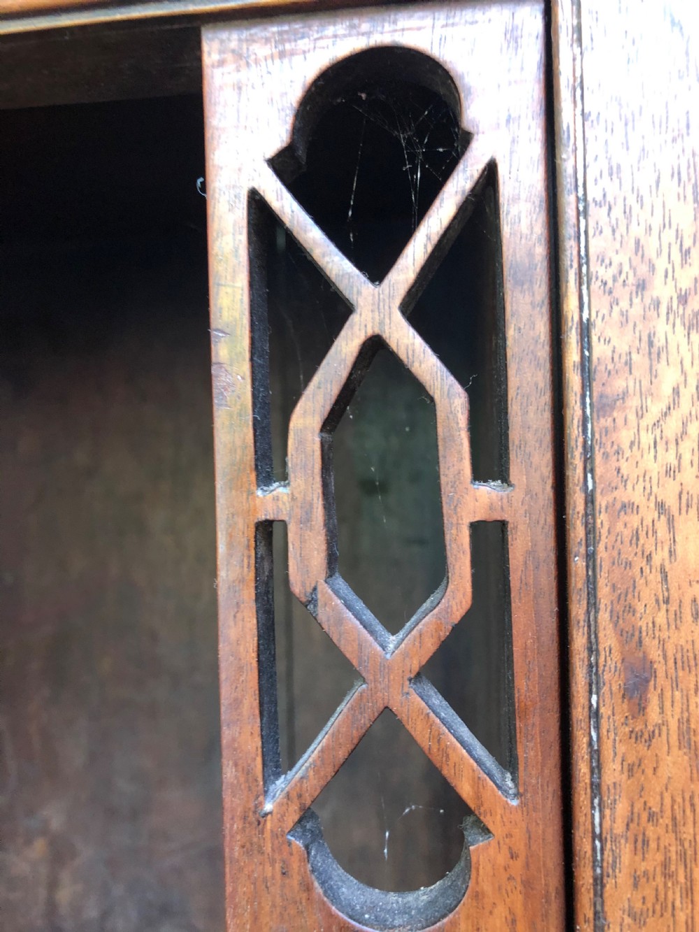 A mid-19th-century Chinese Chippendale revival mahogany glazed china display cabinet elevated on a matching stand with geometric fretwork detail. View XVII