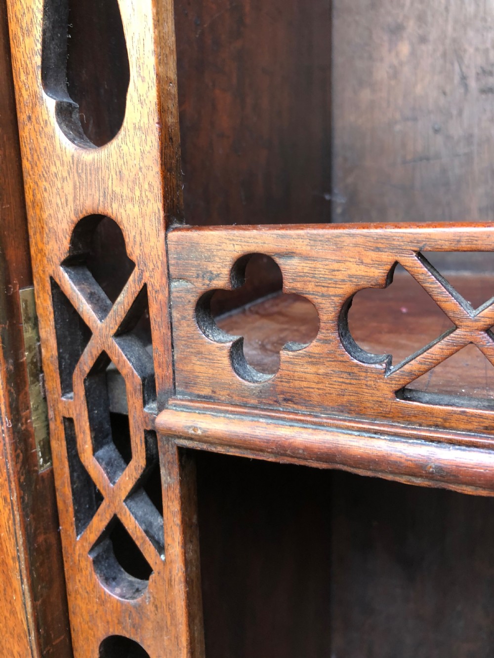 A mid-19th-century Chinese Chippendale revival mahogany glazed china display cabinet elevated on a matching stand with geometric fretwork detail. View XVIII