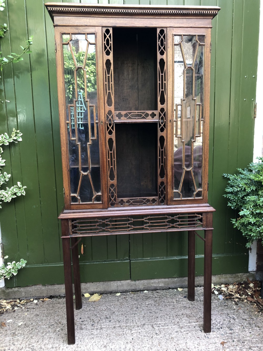 Mid C19th Chinese Chippendale revival style mahogany glazed china display cabinet on stand .