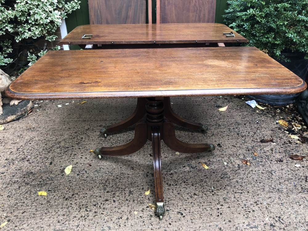 Fine early C19th Regency period mahogany twin-pillar dining table. View X