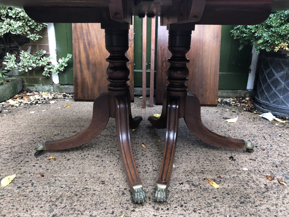 Fine early C19th Regency period mahogany twin-pillar dining table. View XI
