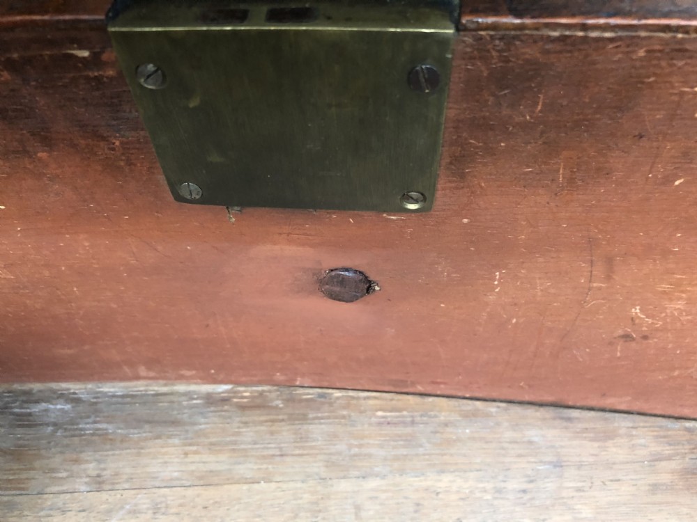 An early nineteenth-century George III mahogany bowfront chest of drawers featuring two short over two long drawers with turned knobs and splayed bracket feet. View X