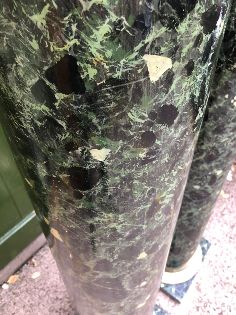 A pair of tall mid-19th century cylindrical wooden display columns painted in a green and black faux verde antico marble finish with square bases. View VIII